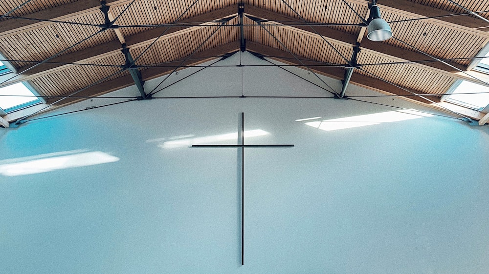 a cross in the middle of a large building