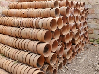 Cardboard separators arranged neatly among flower pots.