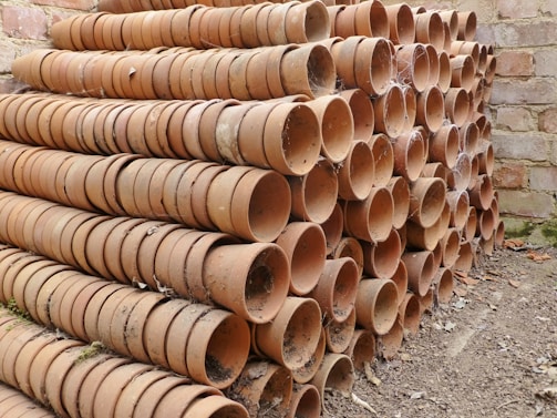 Cardboard separators arranged neatly among flower pots.