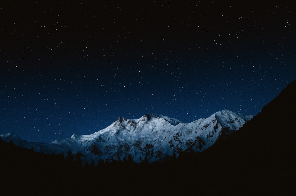 snow-capped mountain at night