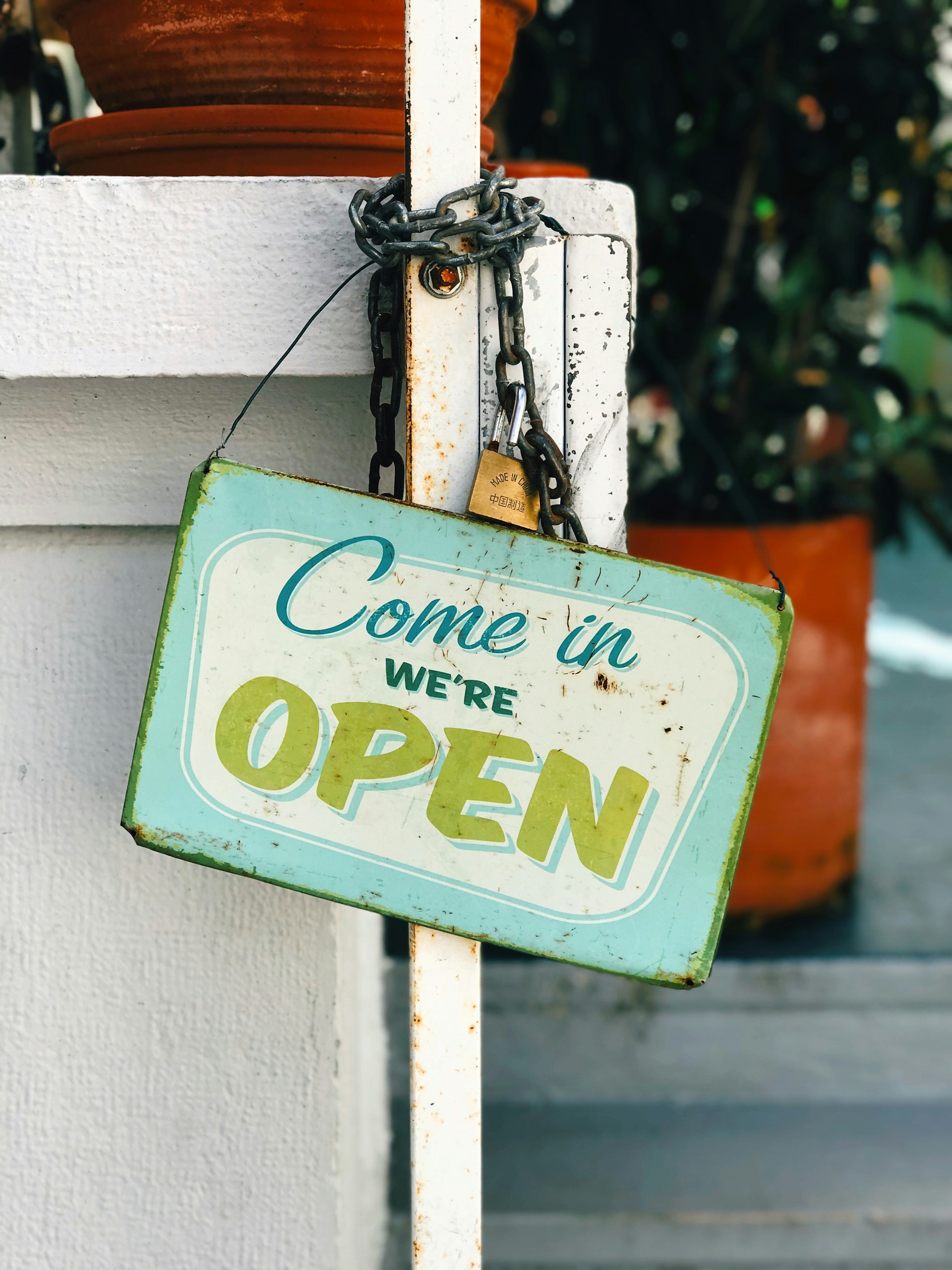 blue and yellow come in we're open sign