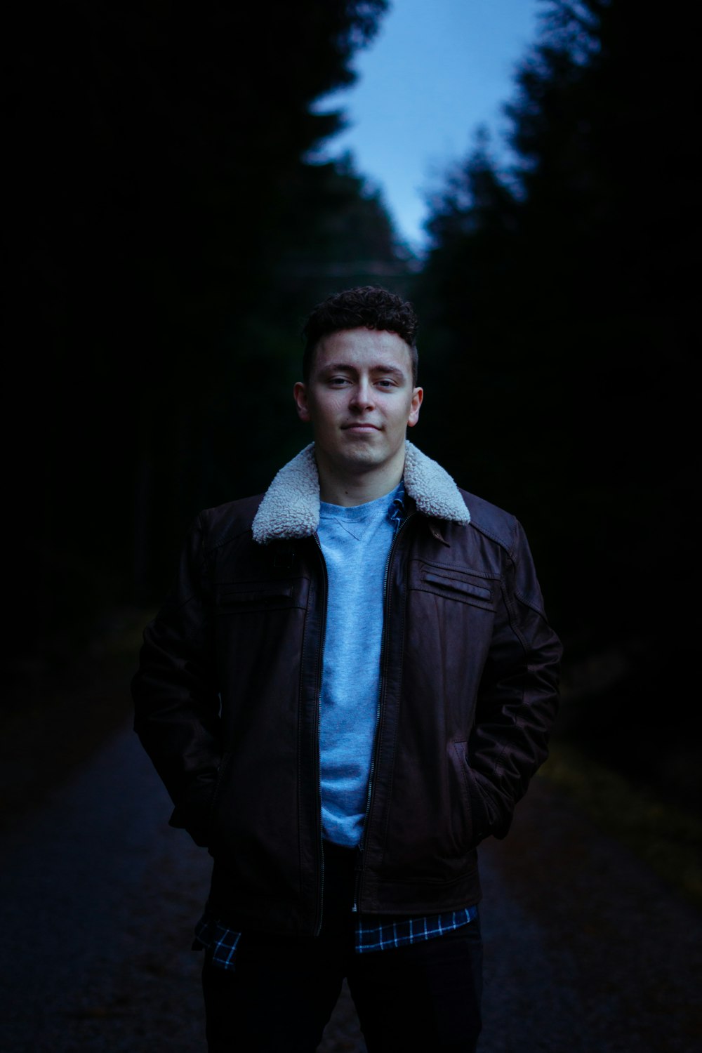 man wearing brown leather jacket