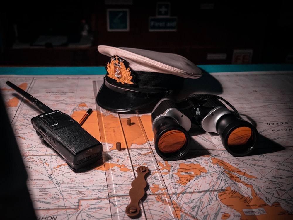 binoculars, walkie talkie, and sailor's cap