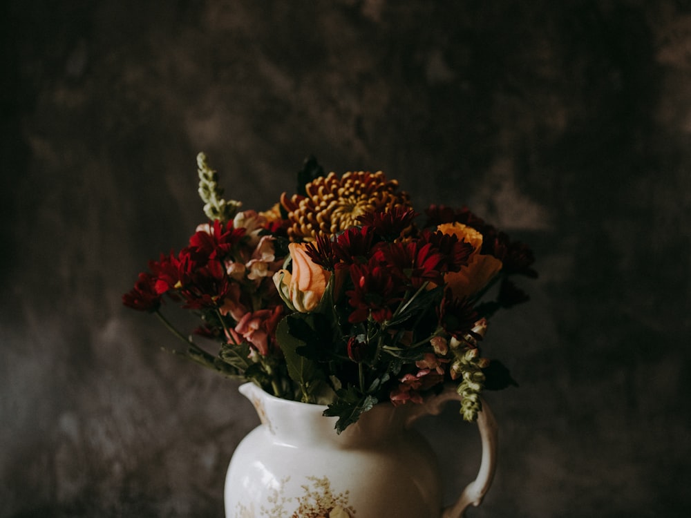 red and yellow flower in vase