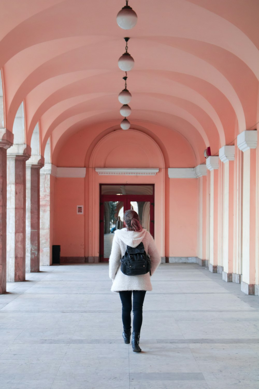 woman walking inside building