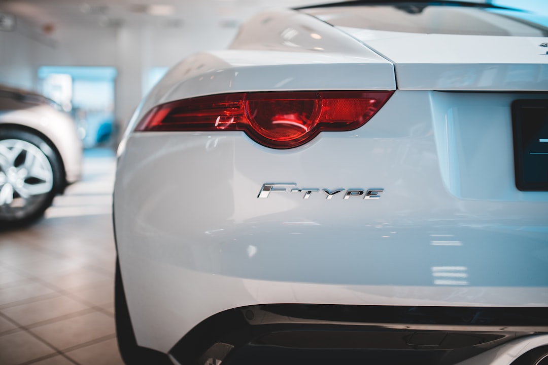 white jaguar F-Type coupe on display