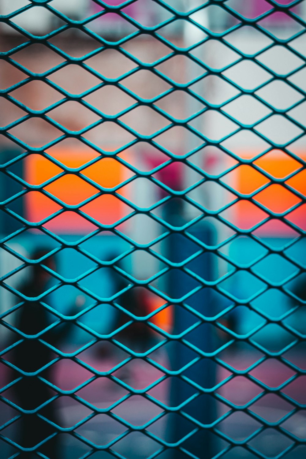 selective focus photography of chain link fence during daytime