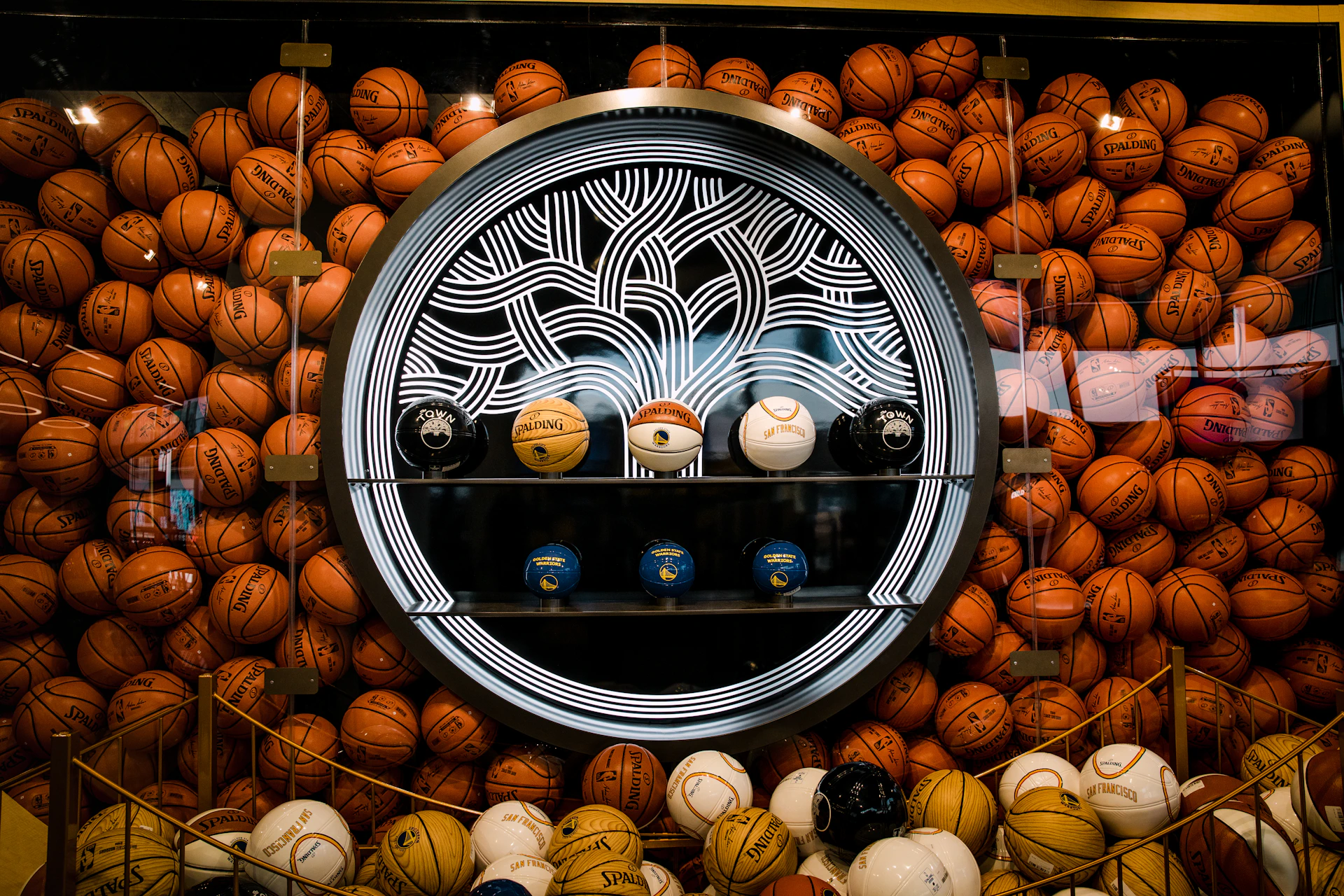 a display case filled with lots of basketballs