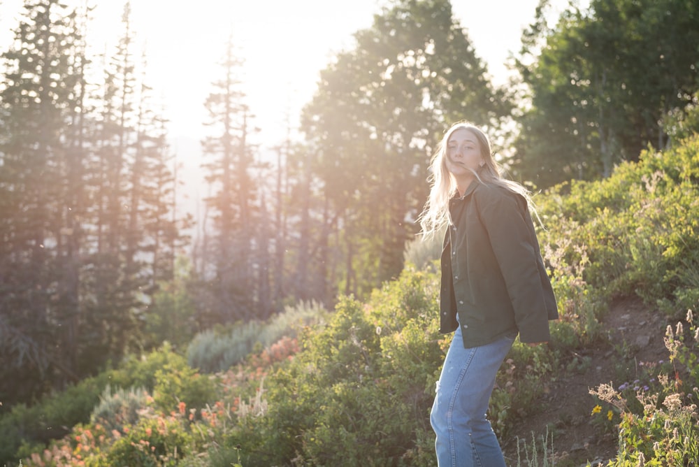 woman standing on plant field during daytime