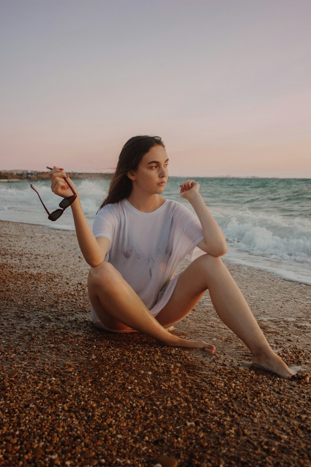 woman sitting on the seashore