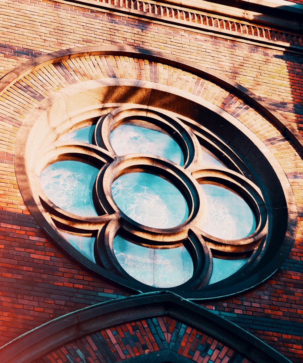 low-angle photography of buildings window during daytime