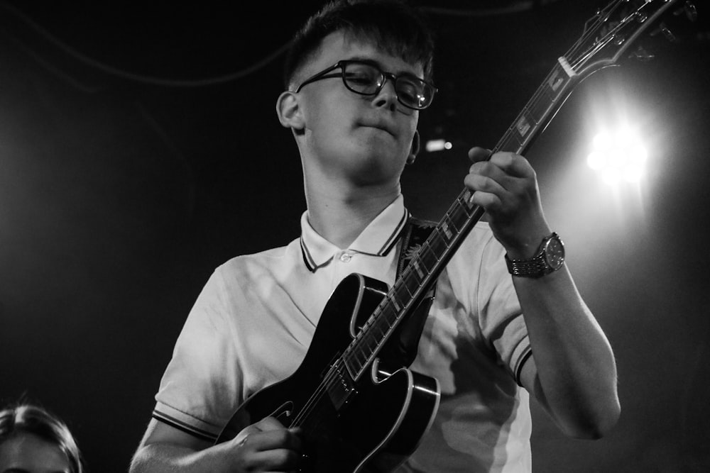 boy playing guitar