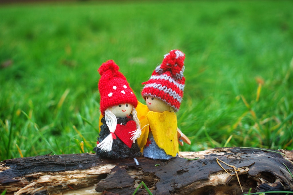 two doll wearing knit caps