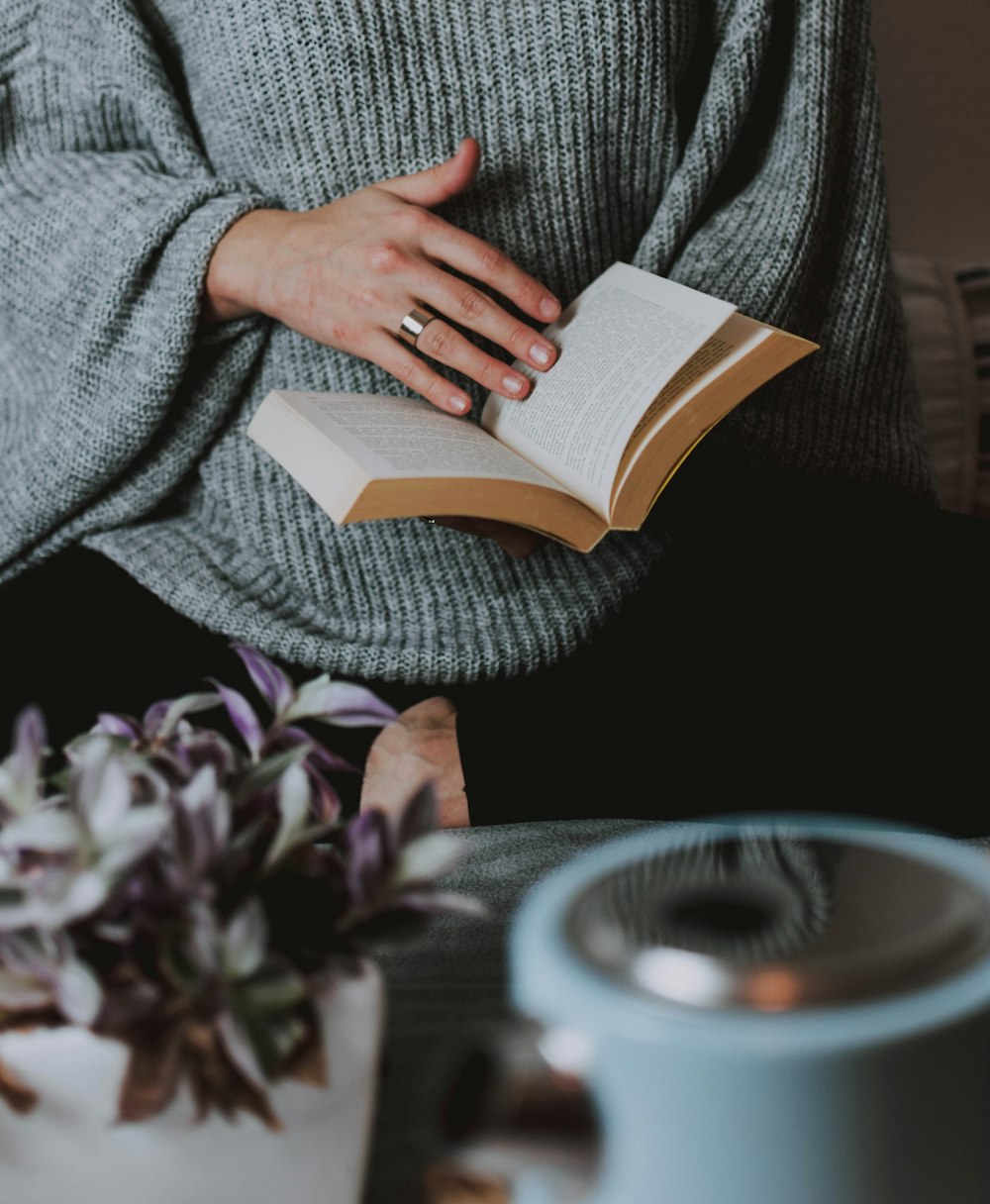 woman holding and reading book