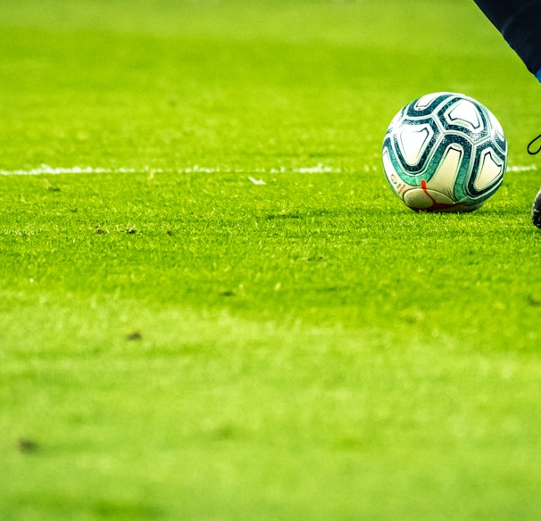 man playing soccer game on field