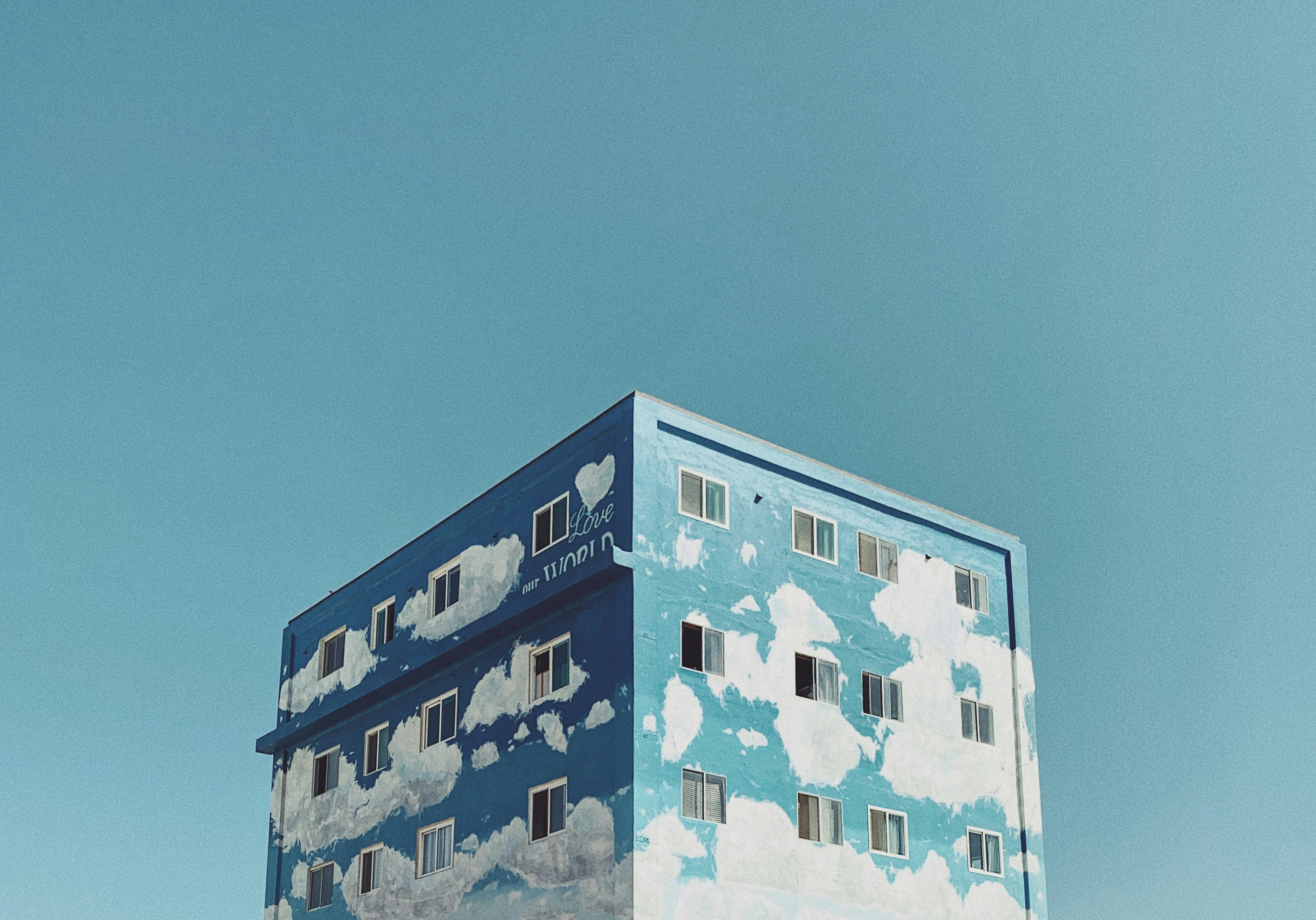 landscape photography of blue and white cloud painted building