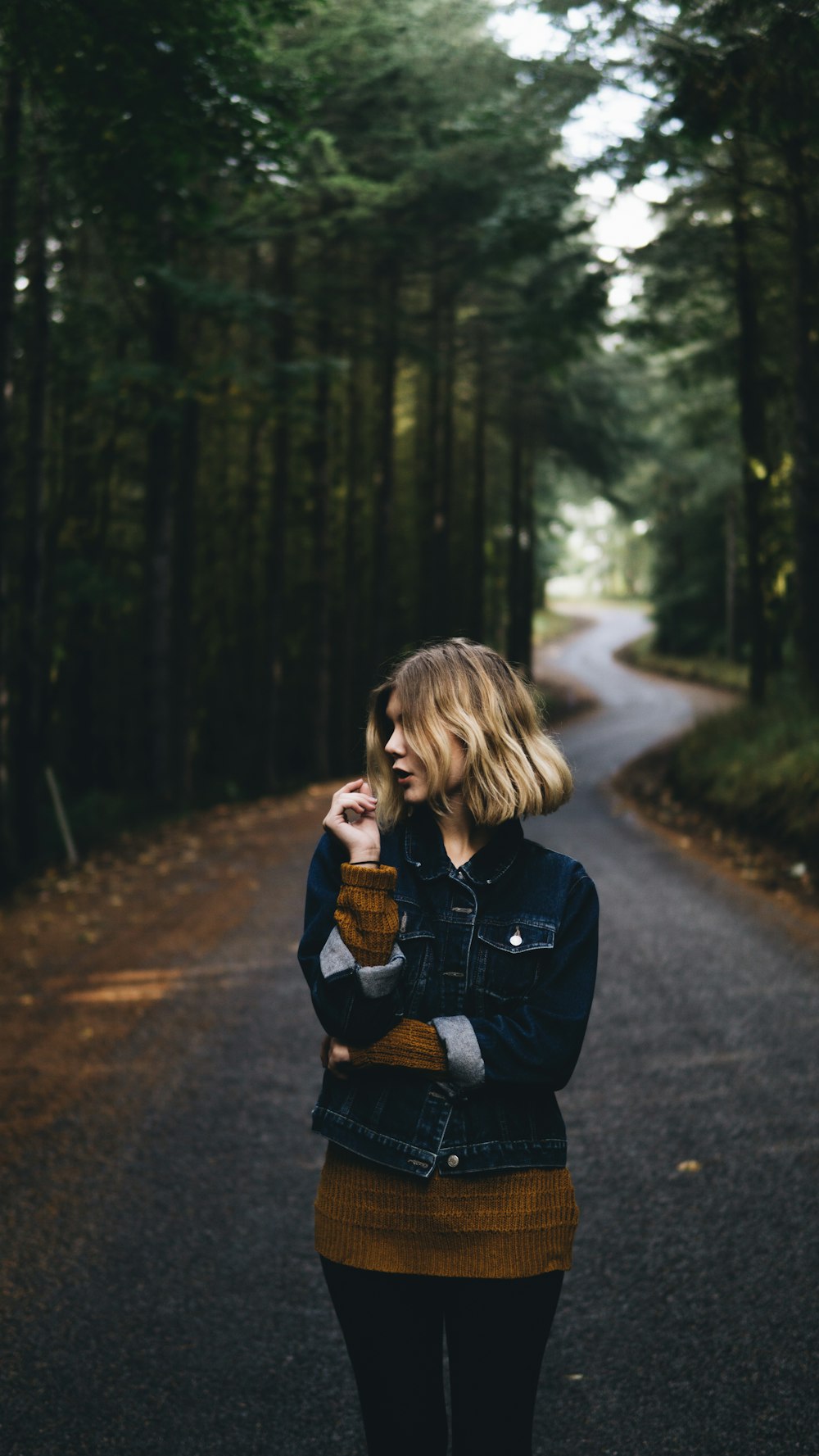 woman wearing blue button-up jacket