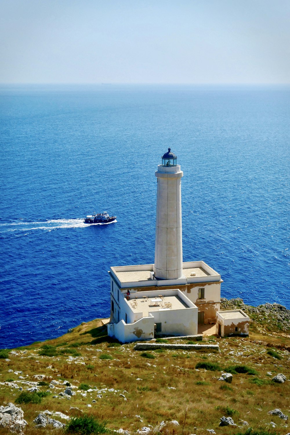 white lighthouse front of sea