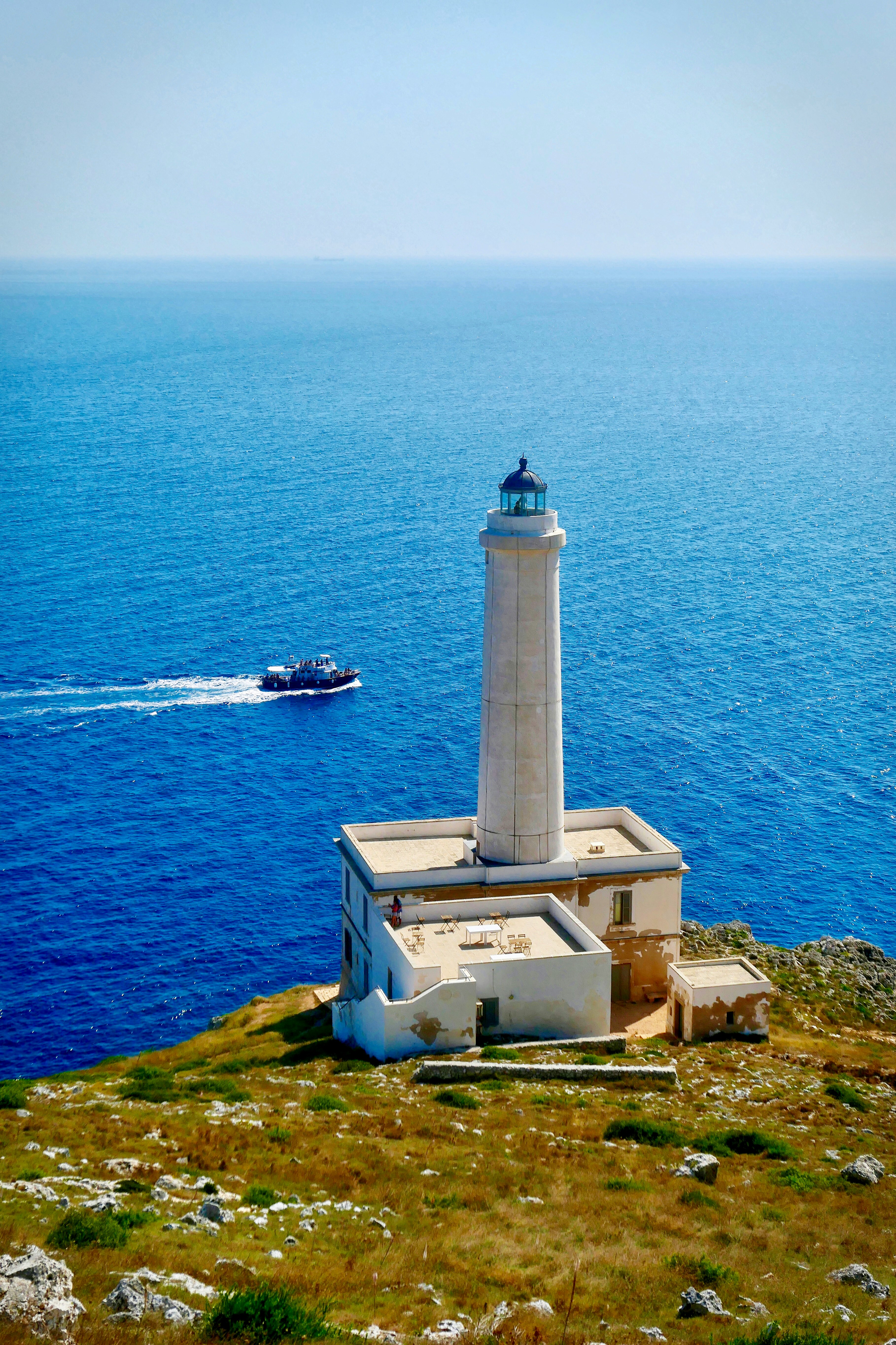 white lighthouse front of sea