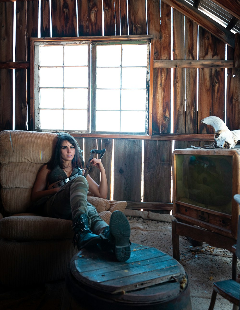 woman sitting on brown chair