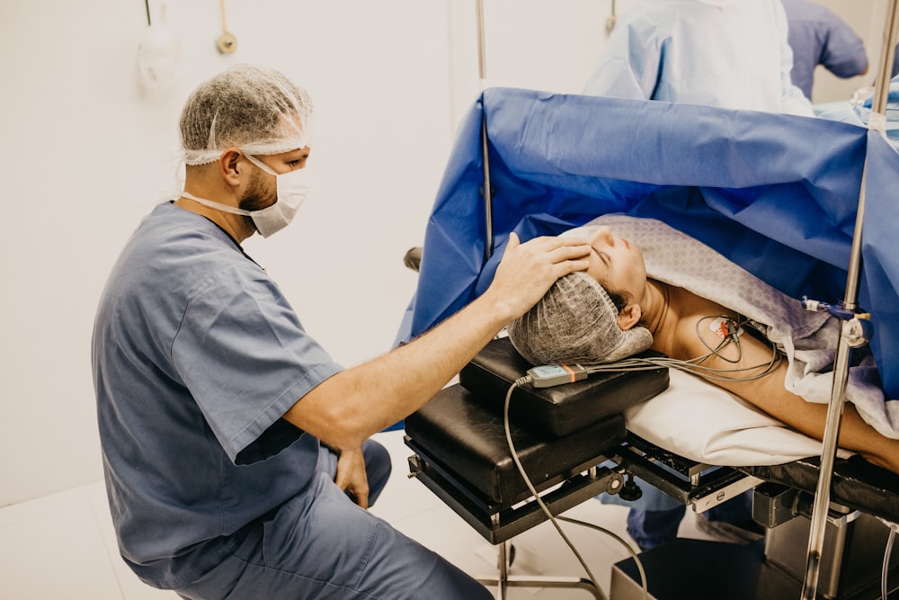 man lying on the hospital bed