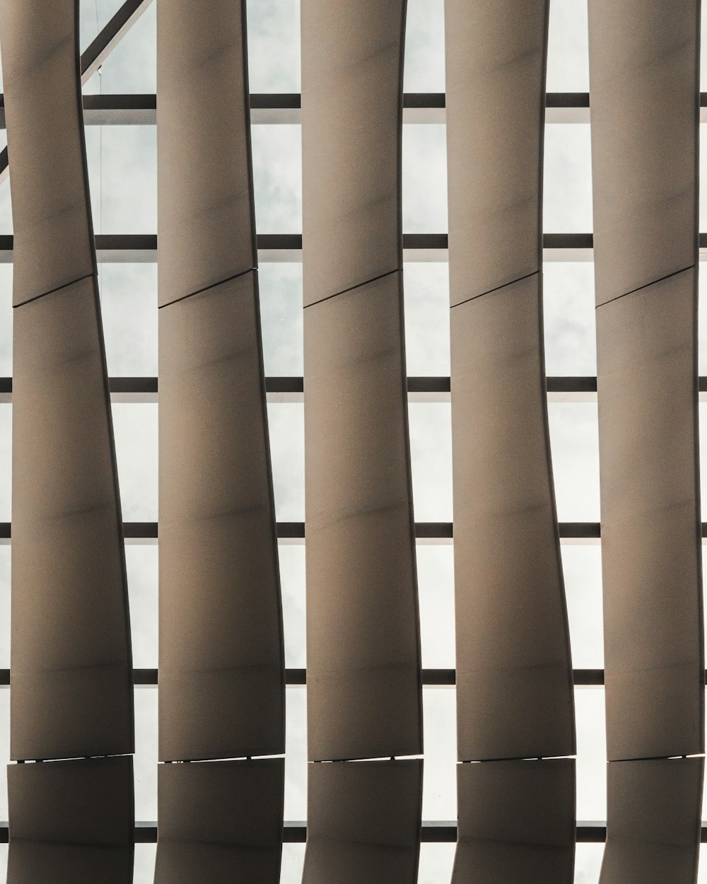 a close up of a window with blinds in it