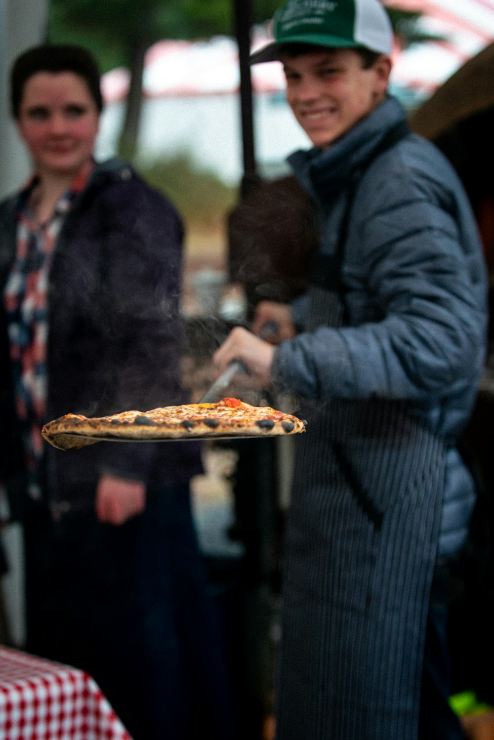 man holding pizza