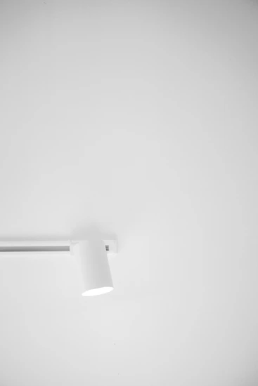 a black and white photo of a ceiling light