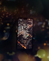 A vibrant screenshot showcasing a neon-lit futuristic cityscape from our top mobile game.