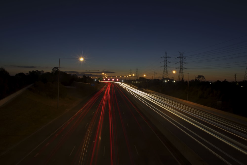 time lapse photography of vehicles on road