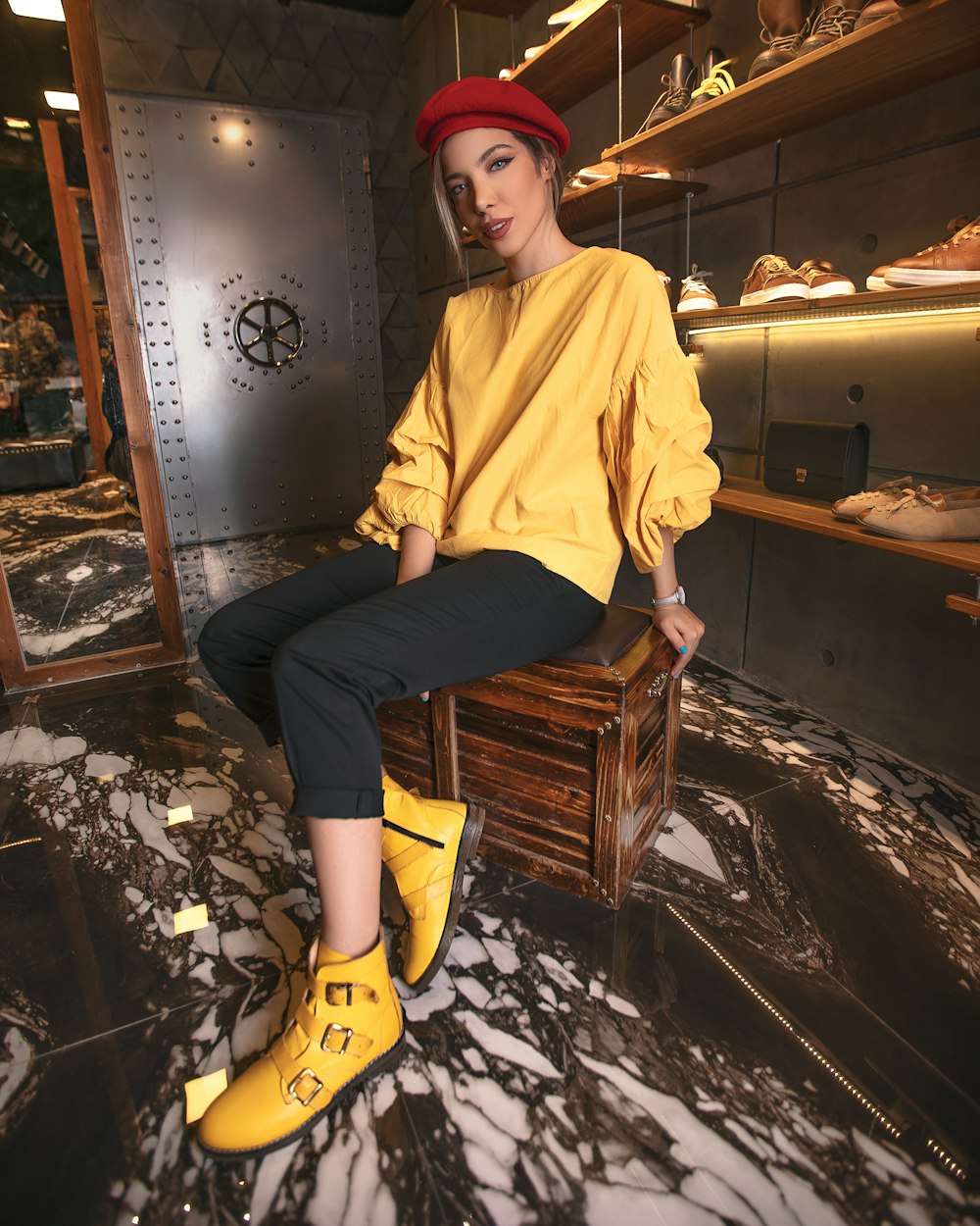 woman sitting on stool in shoe shop