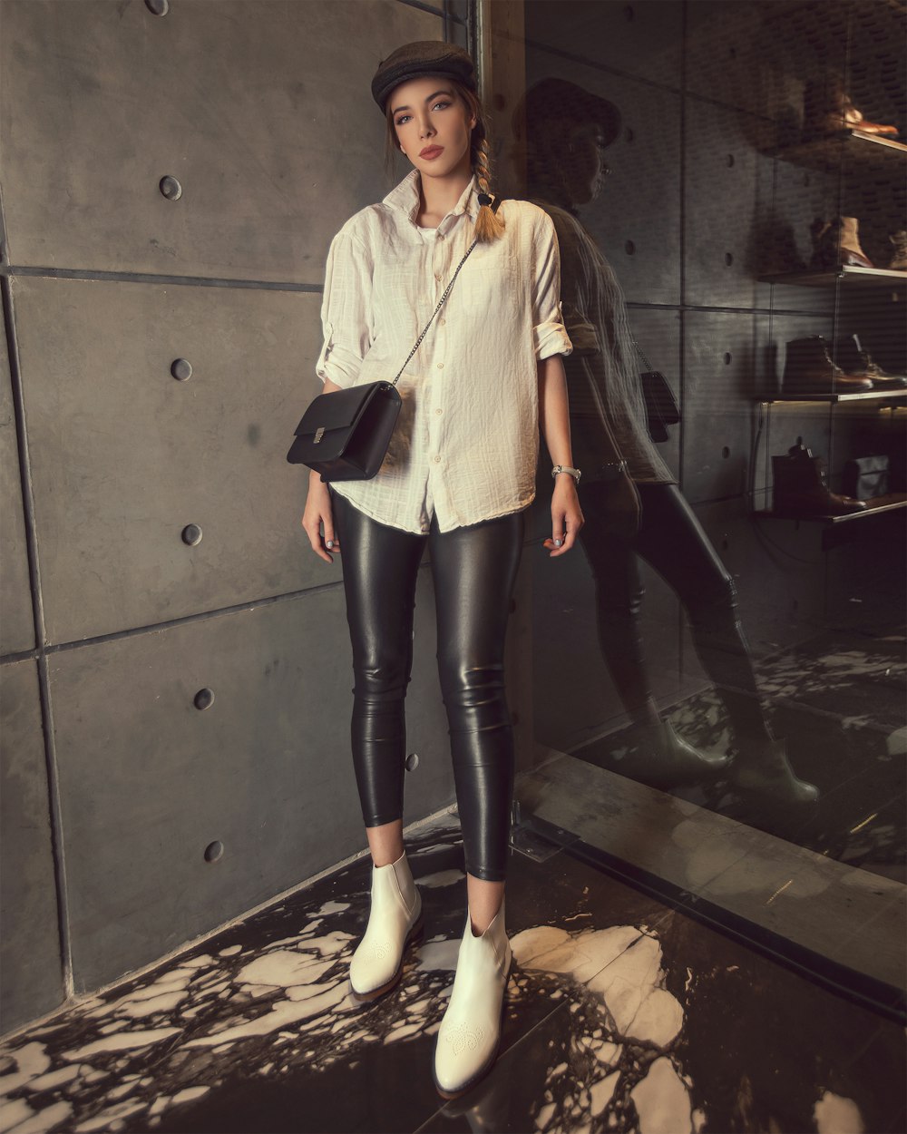 woman wearing white dress shirt and black leather leggings