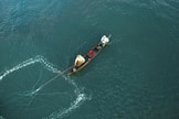 person on brown wooden canoe boat
