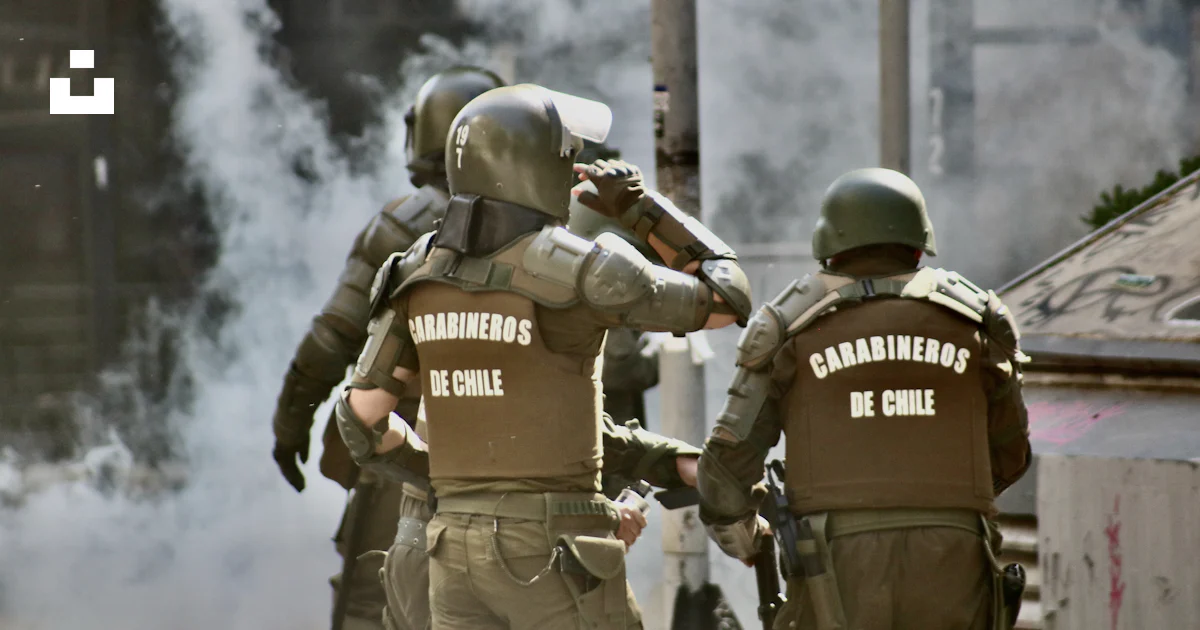 Men Arguing At Riot Three men in riot armor near buildings photo – Free Chile Image on Unsplash