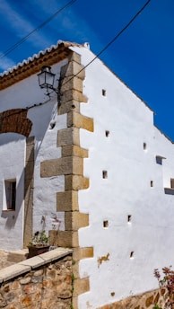 Exterior view of a traditional Menorcan building under inspection.