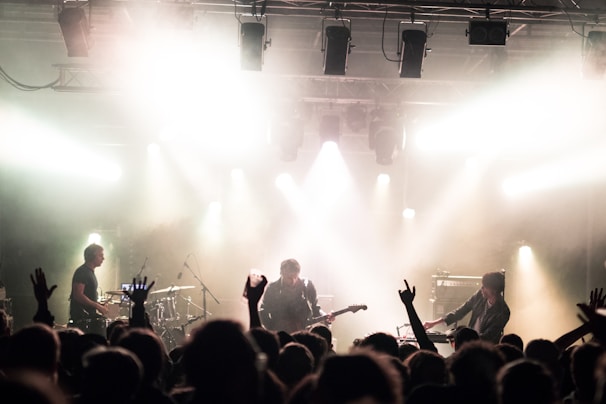 A dynamic stage with bright lights and a live band performing.