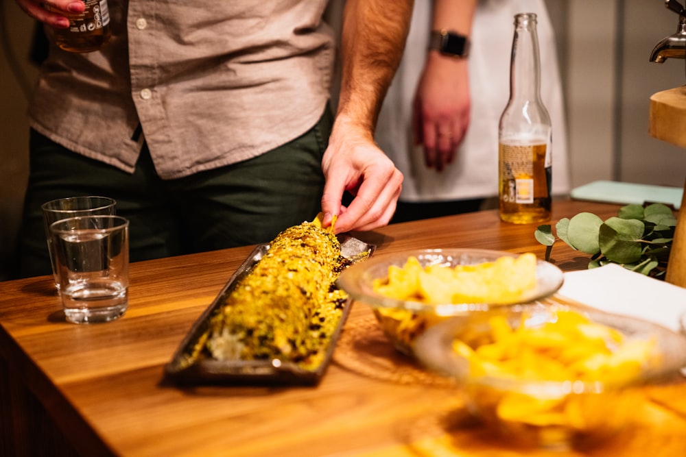 selective focus photo of man about to pick the food