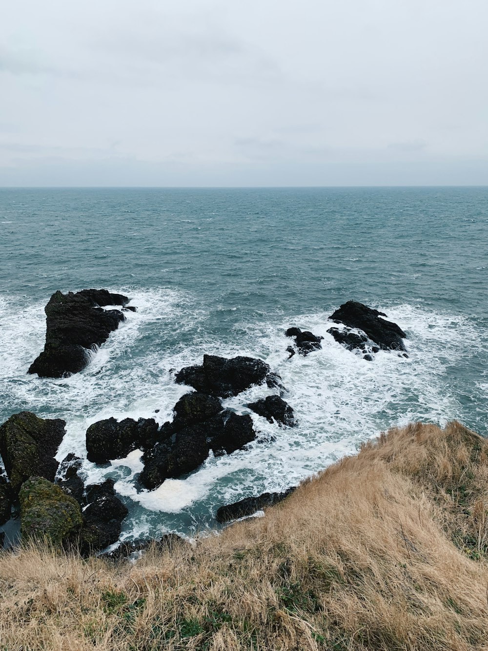 waves crashing on rocks and shore