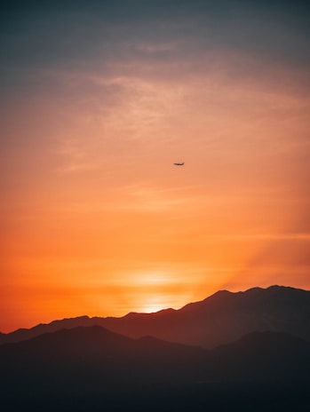 A breathtaking sunset over a serene landscape, symbolizing the beauty of travel.