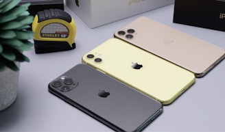 three assorted-generation iPhones