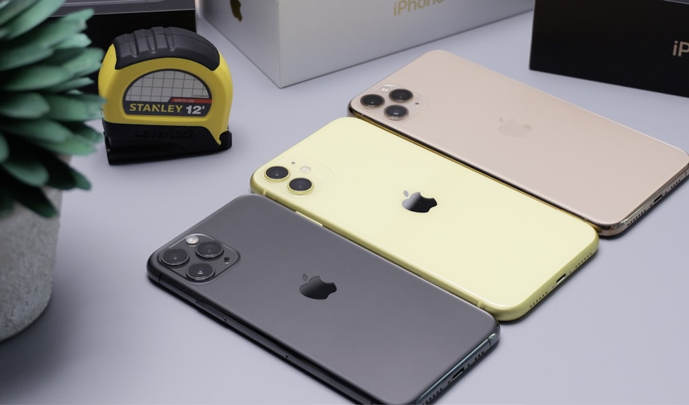 three assorted-generation iPhones
