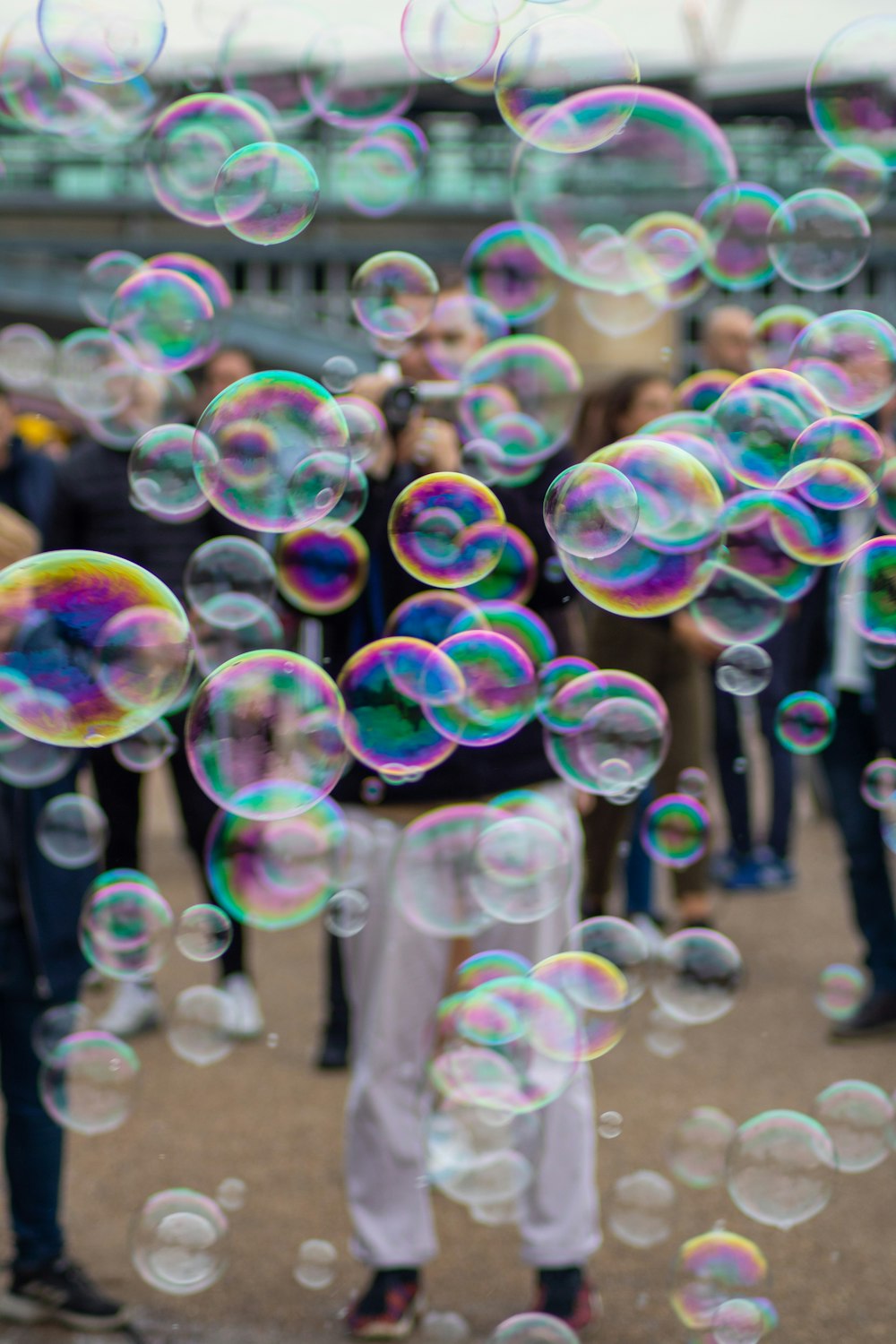man standing near bubbles