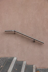 gray stainless steel railings and gray stairs