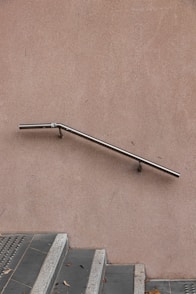 gray stainless steel railings and gray stairs