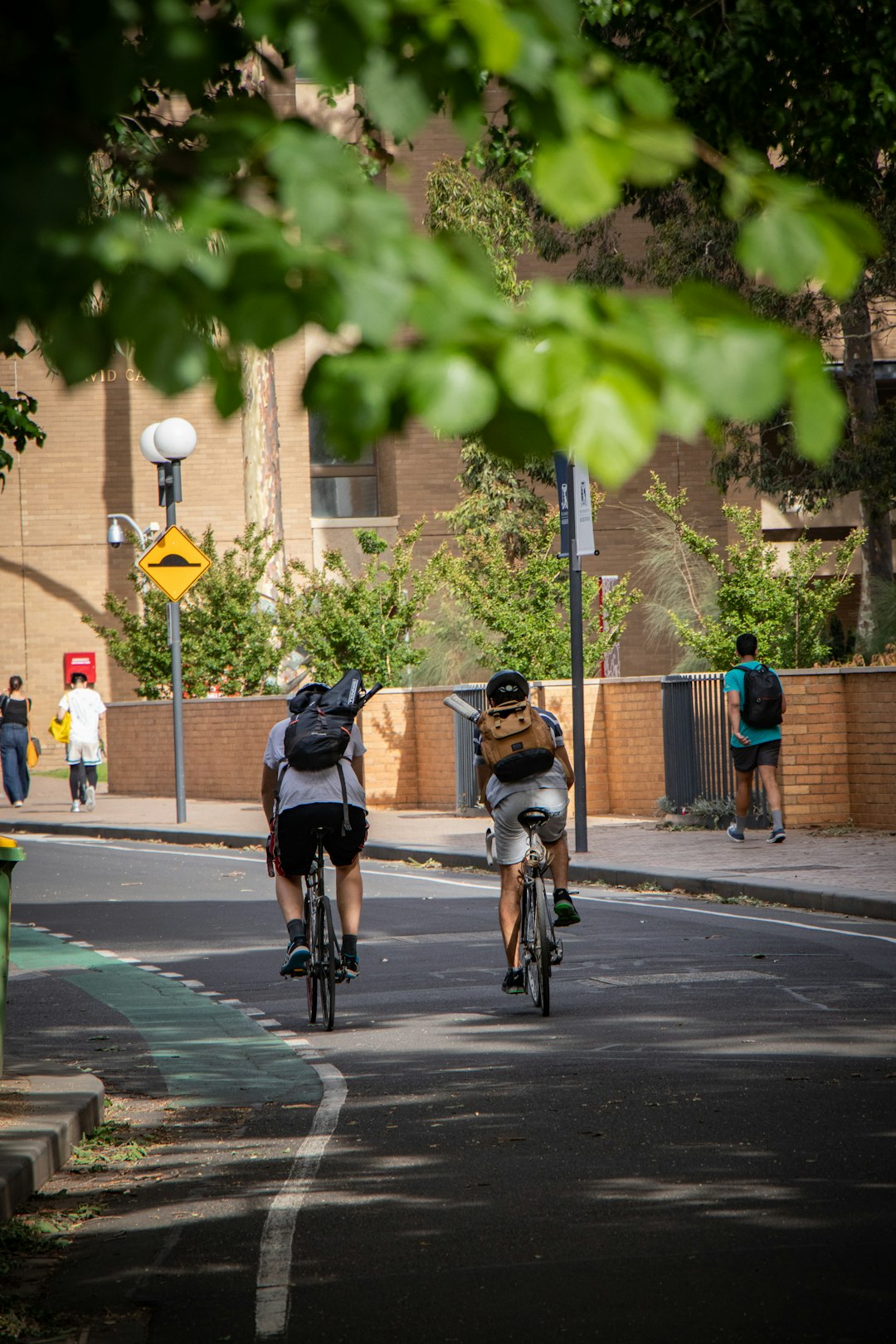 two men riding bicycle