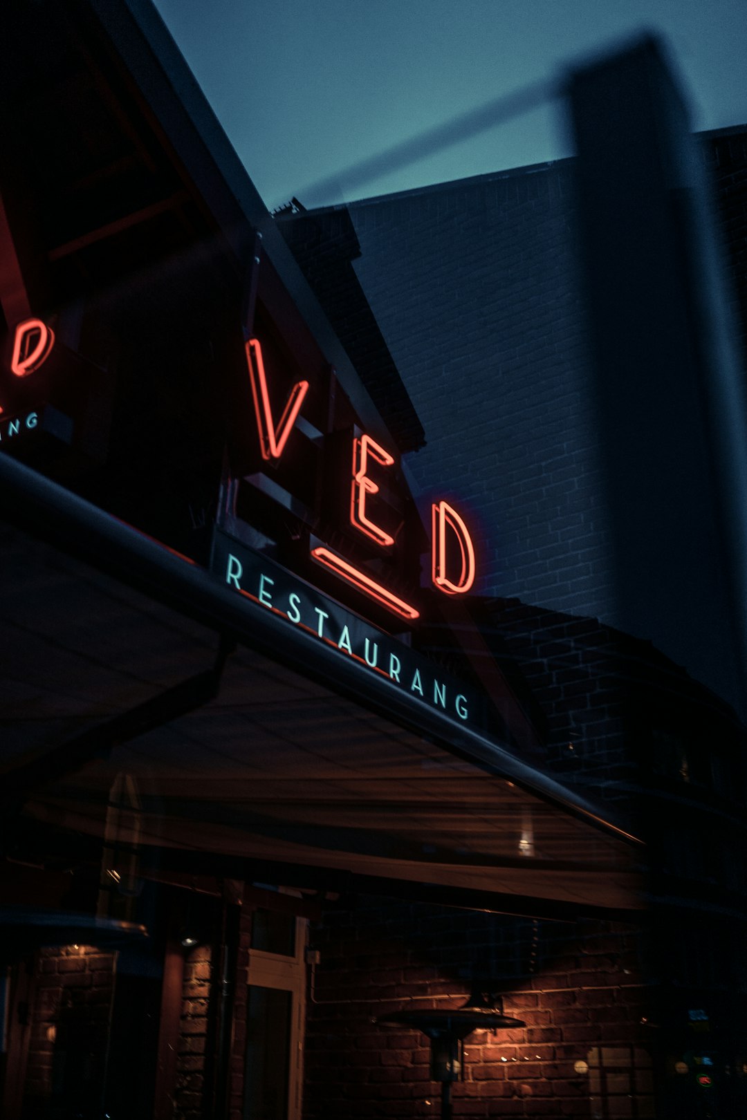 Ved signage at night