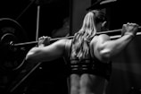 woman lifting barbell