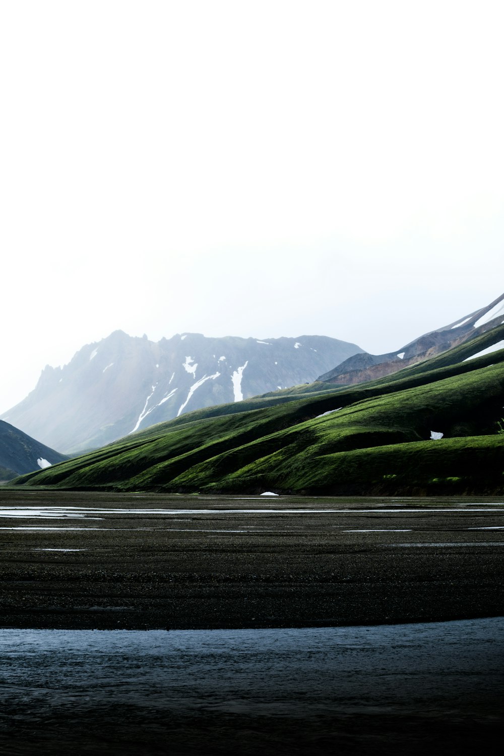 view photography of mountain and lake during daytime