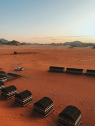 a desert with a bunch of beds in the middle of it