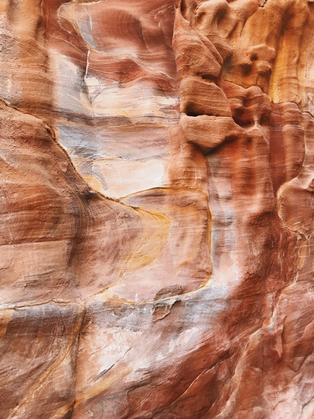 a large rock formation with a very tall rock face